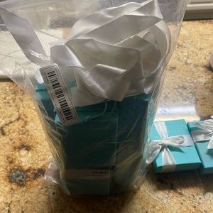 Authentic Tiffany & Company boxes. Includes ribbon and a few cards. 10 boxes.